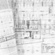 a rolled up blueprints on a table - progetto costruzioni